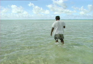 Bikeman Islands with man walking on submerged land